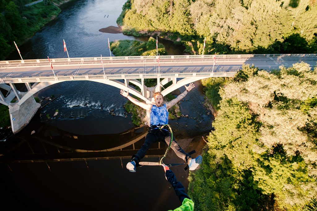Tandem bungee jump in Sigulda — two people jumping together