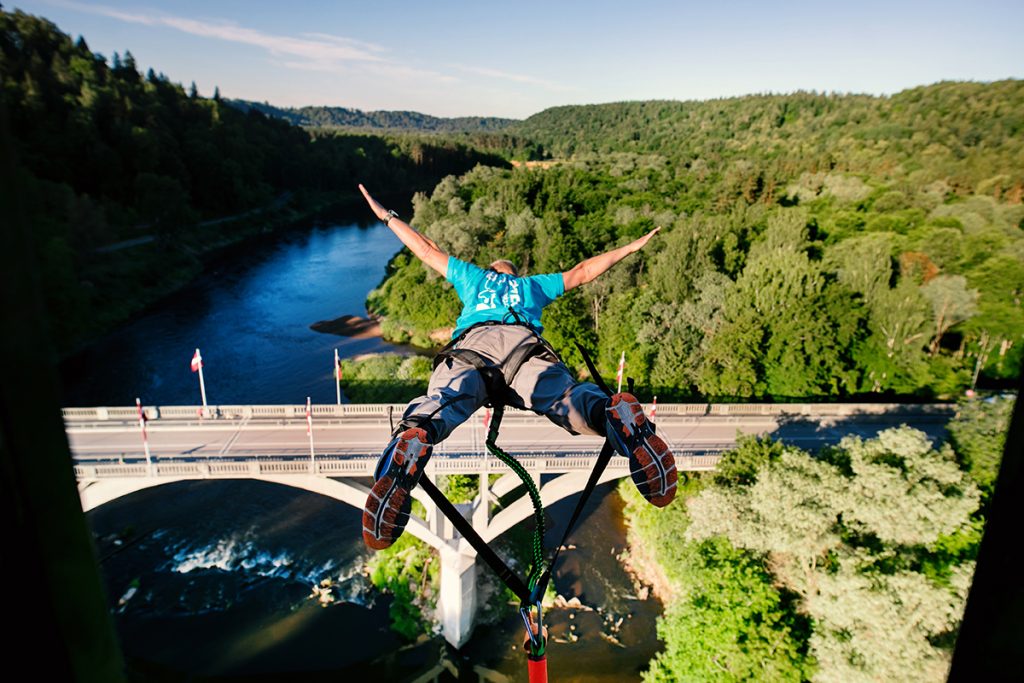 Bungee jumping from the Sigulda cable car above the Gauja River valley